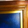 detail of custom made solid mahogany wood frame with gold trim