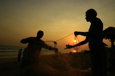 Fishermen Indian on the beach and their fishing net thumb