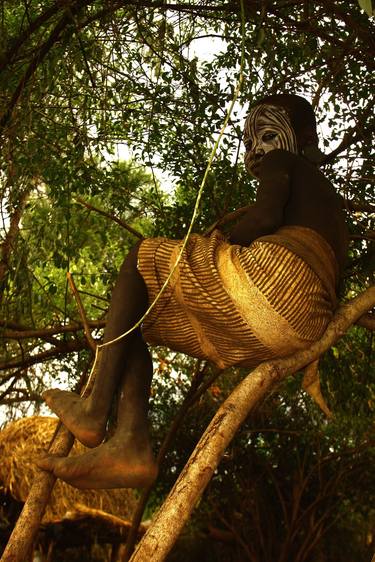 young boy  in the tree of The Omo Valley Ethiopia thumb