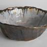 Medium organic modern ceramic sculpture bowl with gold and blue glazes. Great as a decorative accent for a table.  

Its dimensions are 10.5’’ length, 11.5’’ wide, and 3.75’’ tall.

It weighs 4 lbs.