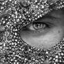 Close up portrait from a series of photography i called Hero where male models are wearing various masks by designer Erik Halley. This mask was worn by one of Madonna's dancer during the super bowl in 2012.
These mask are "haute couture", made entirely by hand with Swarovski glass and chirurgical steel.
The close up on the mask reinforce the idea of a lizard skin.
This picture was exhibited for the first time in Bruxelles in 2017