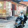 detail of kid on bike and the other on motorscooter