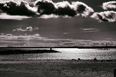 moody image of the coastline  on a cloudy stormy day thumb