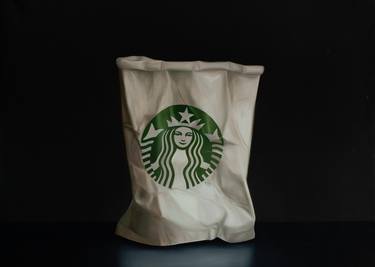 Crumpled Starbucks paper cup thumb