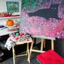 Painting "Black cat on a carpet of red leaves" in the studio.