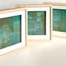This series of paintings was created with cold wax medium and oil paint on paper. The pieces are 9 x 9 inches, framed with shadow-box mat with anti-reflective glass. Each features a number from 1 to 6, and hexagons are combined with intersecting circles. The colors are shades of teal, turquoise, blue, green, gold, copper, orange and verdigris.
