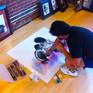 Artist David Pucciarelli completing the original Queen art piece in his gallery