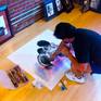Artist David Pucciarelli completing the original Queen art piece in his gallery