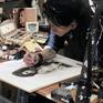 Artist david Pucciarelli completing an Amy Winehouse artwork