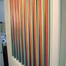 a kinetic work that change color views.made from tapered pvc strips and tape,then resin coated