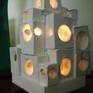 my take on a mediterranean villa,whitewashed and distressed w/age-made from fand formed,shaped molded pvc-lit with a dimmer controlled switch and nite lite bulb that doesnt heat up so can be left on .unlike clay/porcelain,the pvc is indestructable.a nice little accent lamp