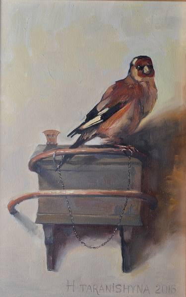 The Goldfinch. A copy of famous Fabritius painting. Framed in a wooden frame thumb