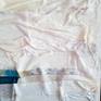 "Lake Effect No. 2" draws from the feel of being beside a lake in a mist, in the hillsides of Northern California. Water here is of constant concern, as is the level of our lakes and streams. "Lake Effect No. 2" employs fabric and acrylic to create this rich, dimensional painting. The sculptural folds in the surface become translucent in the process, allowing the painting beneath to show through to varying degrees. Beneath the cloth is a painting of the shoreline of a lake.