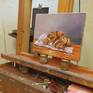 On the easel in the studio