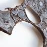 welded wall sculpture made of burnt mirror polished steel | welded with corten steel