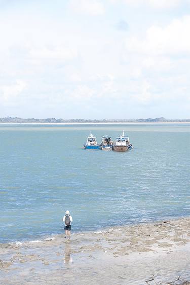 Four boats and a fisherman thumb