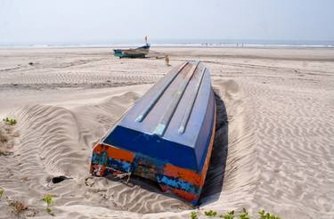 An overturned boat, non-functional and abandoned in the beaches of Konkan. thumb