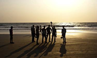 Friends during sunset at Arambol Beach, North Goa. thumb