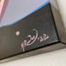 Close-up view of the artist's signature