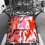 This piece depicts the famous Le Mans pits, reflected on the bonnet of a Porsche 906, as if in the Porsche garage. Hundreds of pieces of hand cut vinyl are applied to the surface and then lacquered to give the real object a very surreal look and feel.