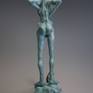 This figure is a very unique peace of art. A claycore formed by my own hands and a cold porcelain coating. Later, a silver primer was coated with an oxidizing agent to become a patina metal effect.