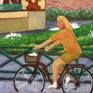 A blonde cyclist girl passes through this popular spot in Rennes. The cathedral is shown in the background.