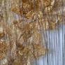 This is a woven piece with silk warp and weft of cotoon and Idonesian silk cocoons that have this natural golden color.