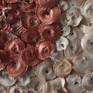 Nature provides us with complex and beautiful forms and I like to take some of those and give them a human touch by disposing pieces to make different compositions. In this piece I used button medik seed pods and placed them in an abstract composition inspired by the work of Andy Goldsworthy (AG). There is a silk thread background.