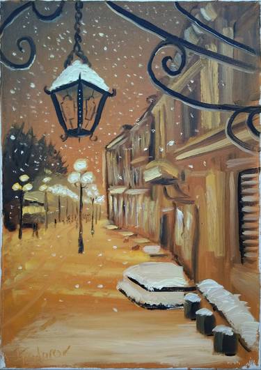 Winter evening street at snowfall thumb