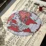 The world map created with threads and nails on a music sheet