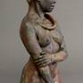 Fired clay original with raku and colored wax finish.
18" x 6" x 5"
Female water based clay original standing figure.