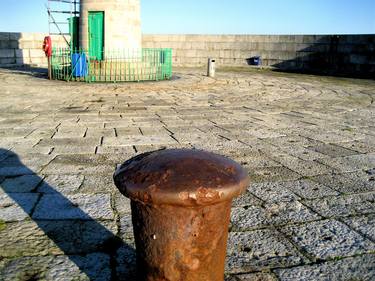 The West Pier -rusty bollard and lighthouse, Dun Laoghaire thumb