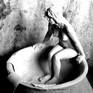 A woman bathing executed in fired clay ,in a modern style ,where i tried to have an atmosphere similar to Degas and Bonnard.If it is asked the same piece would be equally good in a different material such as bronze.Using only one material the studying of form is more evident in its results .