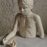 It is a composition executed in clay and turned to ceramic.it is an image of a child  in the water of the sea who tries to touch the paper boat,the vessel of his escape from reality to the world of dreams where all wishes come true.the synthesis is elevated on a marble or plexi glass base to give the spectator the surreal picture composed by a child figure in the sea which is presented in an abstract way and the paper boat as a frozen right vessel which surprisingly flows above the "water".