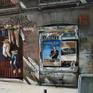 Facade on Calle del Pez in Madrid decorated with trousers filled with soil and plants
