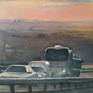 Work from the series skies in which they show vehicles driving on a highway at sunset.