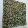 Urban Tablets are a series of uniquely textured, carved, and glazed ceramic maps depicting various cities. Approximately 9 pounds in weight and 13.5” x 13.5” x 1” in size, the tablets come ready to hang. Standard picture hanging hooks are recommended. Some tablets have been cut into quarters and mounted to a support board. Different cities and tablet sizes can be commissioned (slightly higher prices).