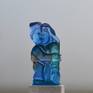 This is a kiln casted sculpture. Made with three different colours of blue . The sculpture is flat on the back  but it is transparant so you see the figures with depth on the backside.( see the detail pictures) The base is made of natural stone and is polished. Base 1,2 h 2 d. 3,5w.
The  base is polished. Ihave  made a mold of this sculpture so I made different colours. It is 21 cm high and the glass is 3cm. thick.