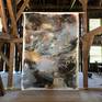 The painting shown in an old barn. ( portrait format )