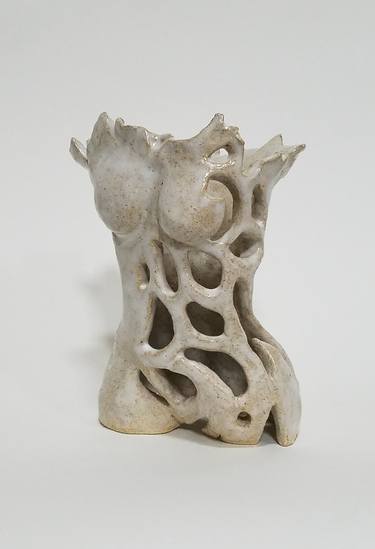 Small female torso, white, carved thumb