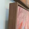 framed in a subtle contemporary walnut veneer frame
