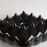 The ceramic work start like a documentary about the cosmos  and the univers. It s look like a open space in univers where you can see yourself. Because of the use of the black shiny glaze, that it s perfect to create this mood.
