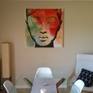 This modern portrait painting in acrylics involves the layering of colours to create interesting colour effects, from muted greens and blues to vibrant reds and oranges. Black creates depth, definition and contrast, adding to the vibrancy of the colours. The edges of the canvas are painted white. Wired and ready to hang.