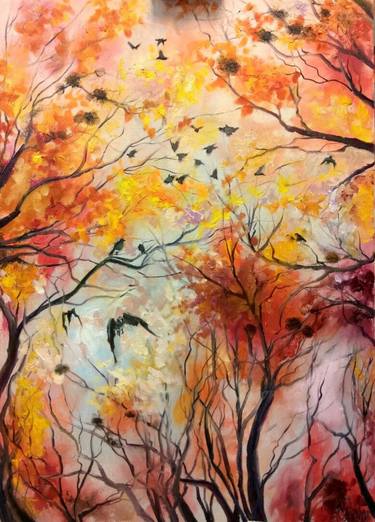 Flying ravens on the background of autumn trees thumb