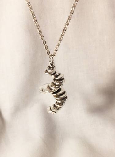 Silver spiral as a pendant thumb