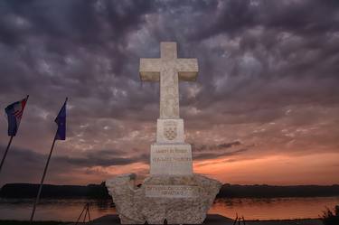 White cross - monument at sunrise thumb