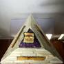 Pyramid shaped lamp, purple soft light effect, marble, wood and bone as materials.