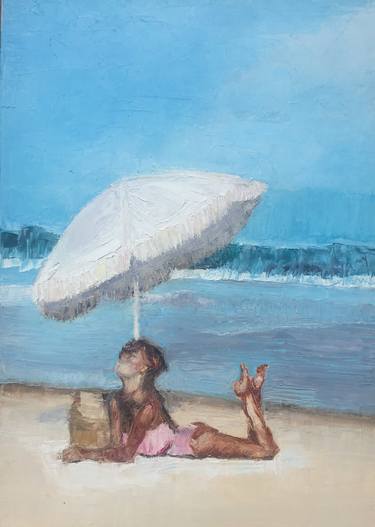 Girl on the beach and a white umbrella thumb