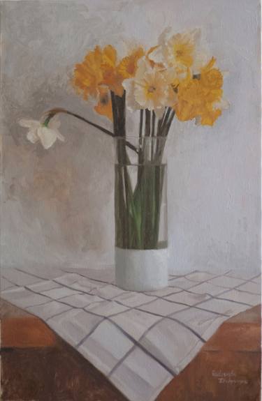 Yellow daffodils in a glass vase thumb