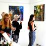 Artist and guests at the Rocking Art Exhibition with painting in background